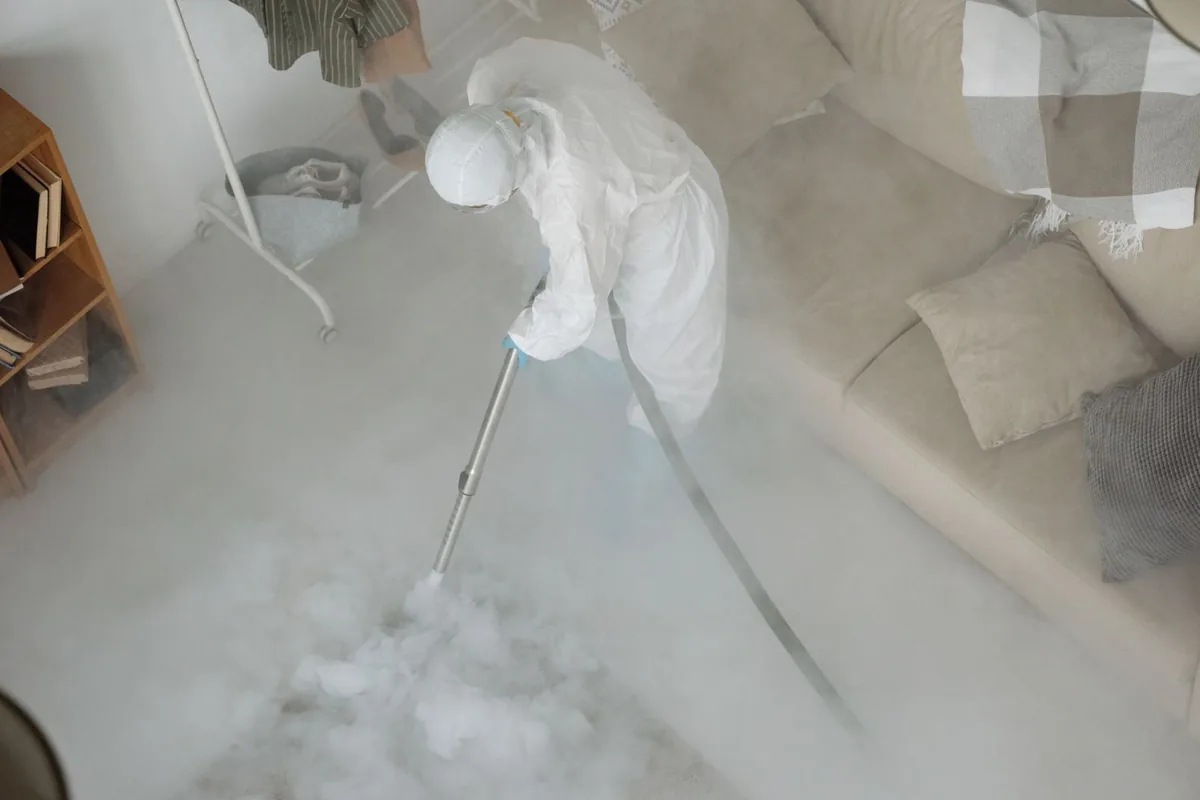 Biohazard cleanup technician in protective equipment, Sissonville, WV